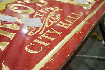 Detailed gold leaf work by SignAccess makes the classic carved sign of Carlo's Bakery in The Florida Mall shine